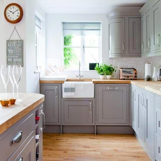 We love this country kitchen with grey painted cabinetry and wooden worktops – a classic combination that will forever be stylish