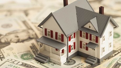 Single family house on pile of money