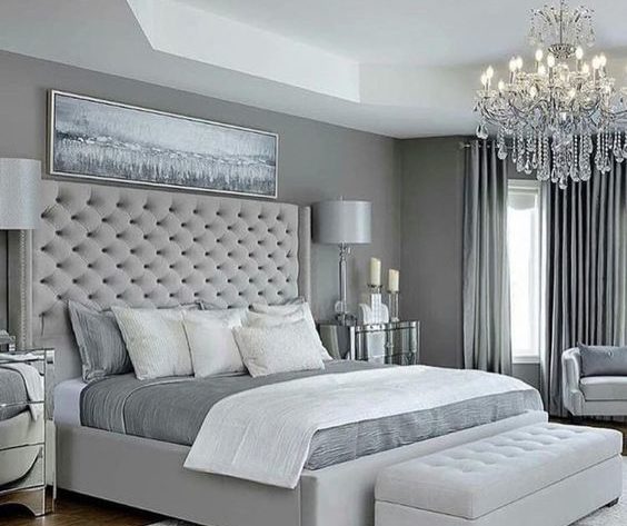 Gray themed bedroom with gray cushioned headrest 