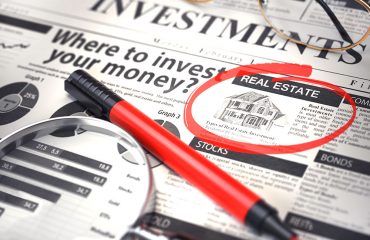 Real Estate is a best option to invest. Where to Invest concept, Investmets newspaper with loupe and marker. 10-Most-Commonly-Asked-Questions-About-Real-Estate-Investment