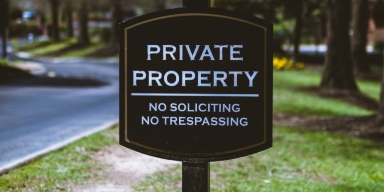 A sign reading "Private property" is placed on the lawn